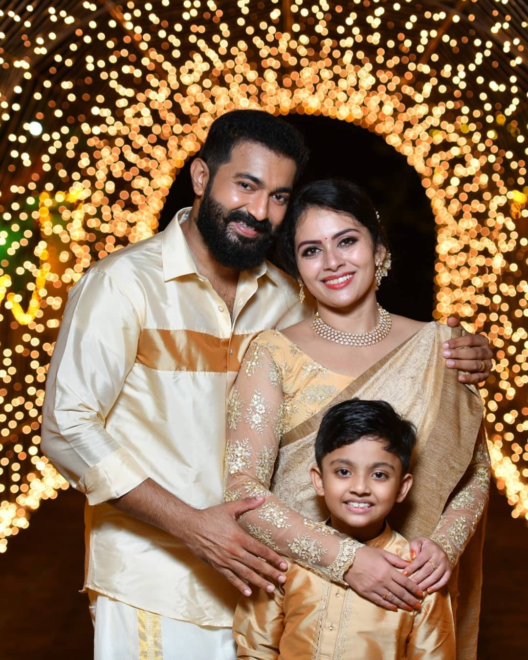 Dhanya Mary Varghese with her Husband and Son